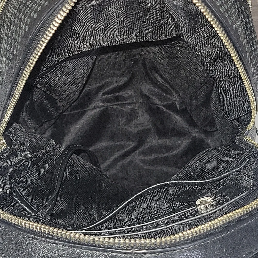 Michael Kors Black Perforated Leather Mini Backpack Bag